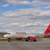Aeronavă AnimaWings Airbus A220-300 rulând pe un aeroport regional din România